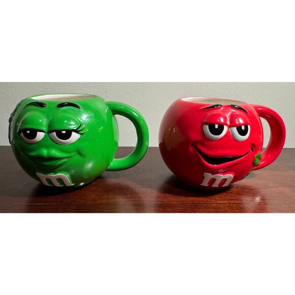 Set of 2 M&M Red & Green Mugs Cups with Holly Rounded 3" Tall Galerie Mars - Picture 1 of 8